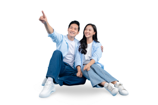 A cheerful couple sitting close together while the man points to something in the distance, suggesting shared anticipation and joy, PNG background