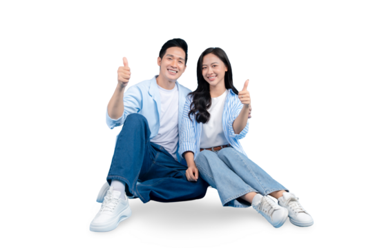 Cheerful couple sitting and posing together happily. They are smiling and doing thumbs up on PNG background