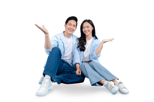 A smiling young couple sitting together and holding hands with open arms. They seem to be inviting on PNG background - Powered by Adobe