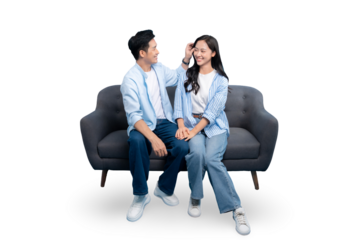 A happy couple sitting on a sofa together. This photo captures a beautiful moment of tenderness and affection on PNG background