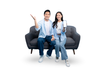 A cheerful couple is sitting on a sofa, the man pointing upwards and the woman is holding a mobile phone,smiling. on PNG background
