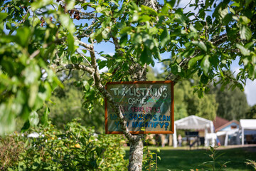 ‘The Listening Game – Close Your Eyes, What Sounds Can You Identify?’ Sign Hanging on Tree in Sweden