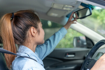 woman adjust car rearview mirror before drive, drives with intent, safe drive, driving practice,...