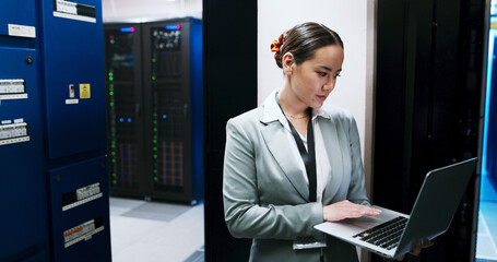 Laptop, typing and woman in data center for cybersecurity, network maintenance or programming....