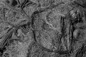 close-up of fisherman’s nets by dock