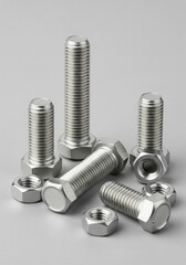 Hex Head Bolts and Nuts on a Grey Background