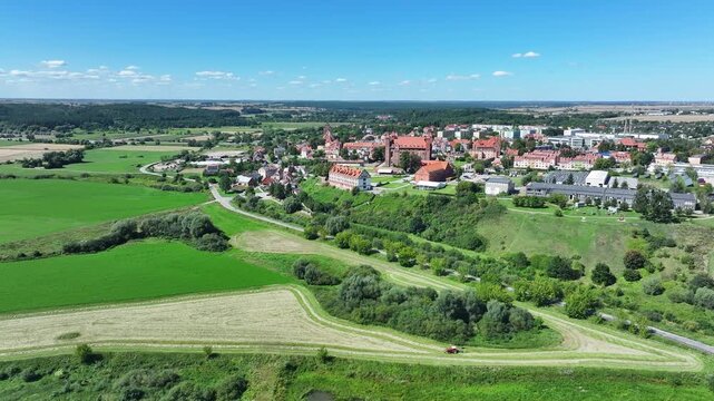 Aerial Gniew Poland Vistula River to castle 2. Northern Poland. Castle construction 13th century by Teutonic Knights. Vistula River. Agriculture land, river, forest and farm rural area.