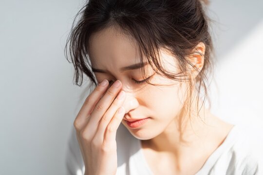 体調不良の女性