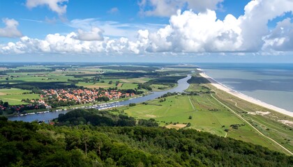 Obraz premium Scenic Aerial View of a Coastal Village and River Landscape.