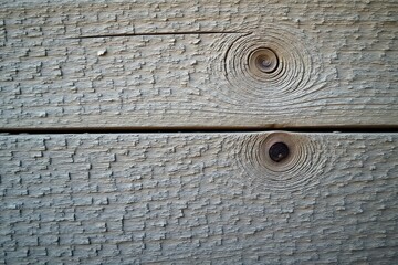 Close-up of weathered gray wood, cracked surface, timber, surface