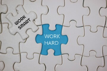 Conceptual Puzzle Representing Hard Work and Smart Work Techniques, highlighted in blue and white puzzle