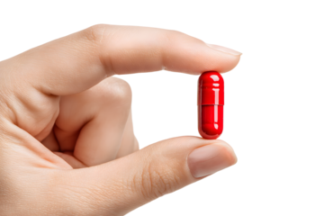 Male hand holding a red pill isolated no background