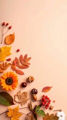 Obraz premium Autumn arrangement featuring leaves, berries, and a sunflower against a peach background. A scene of fall’s best.
