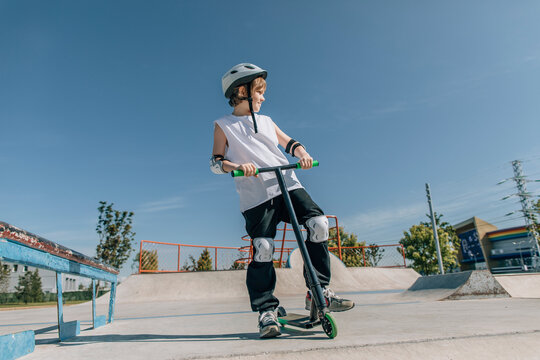 Exciting Skate Park Adventure Young Rider on Scooter