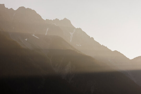 Tranquil scene of Candian mountain filled with rays of sunlight.
