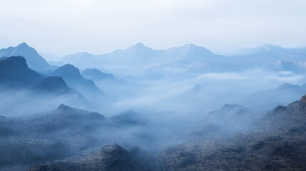 Misty Mountain Range Landscape with Foggy Valleys and Blue Hues