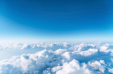 Fototapeta premium High-angle view of puffy white clouds against a vibrant blue sky