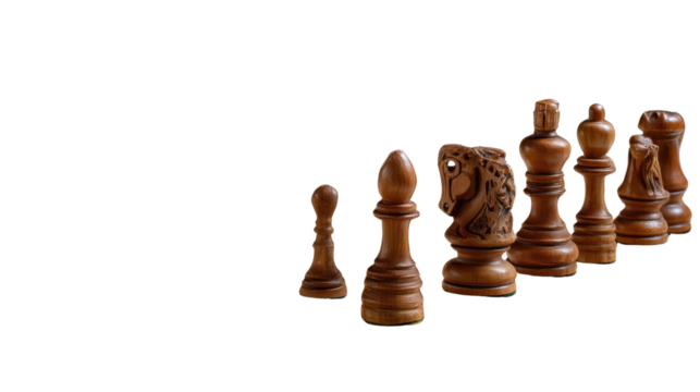 Strategic Lineup: A close-up perspective of a set of intricately carved chess pieces. These chess pieces, with their rich brown tones and varied shapes, stand at the ready.