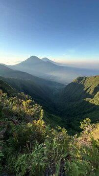 Mount Bismo in the morning with a view of Mount Sindoro and Mount Sumbing. Mount Bismo is located in Wonosobo Regency, Central Java, Indonesia.