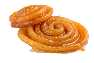 Two jalebi pieces stacked against a transparent background showing their spiral shapes and syrupy glaze