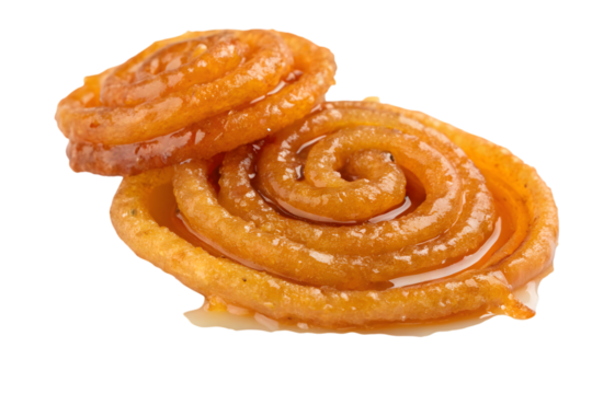 Two jalebi pieces stacked against a transparent background showing their spiral shapes and syrupy glaze