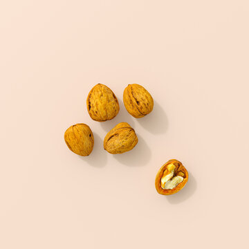 Five walnuts with one half walnut on minimalist background 3d rendering