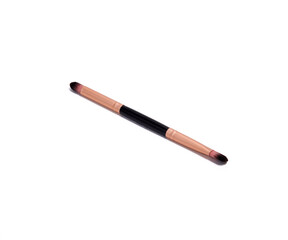 Dual-ended makeup brush with rose gold ferrules and brown bristles, used for blending eyeshadow