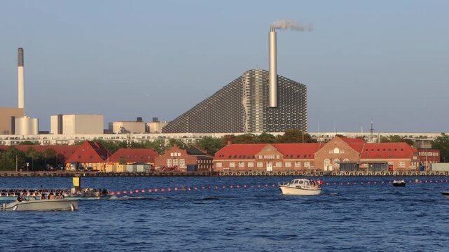 The power plant in Copenhagen, Denmark, which converts waste into energy, showcases innovative architecture and a commitment to sustainability. 