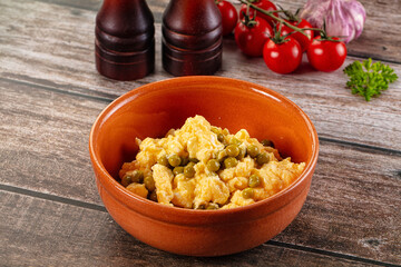Scrambled egg omelet with green peas