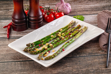 Grilled asparagus sprouts with cedar