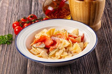 Italian pasta farfalle with salmon