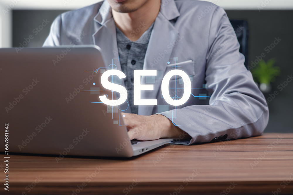 Poster professional using laptop to enhance search engine optimization strategy