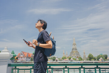 solo travel with asian man chilling see city life in bangkok thailand in summer season