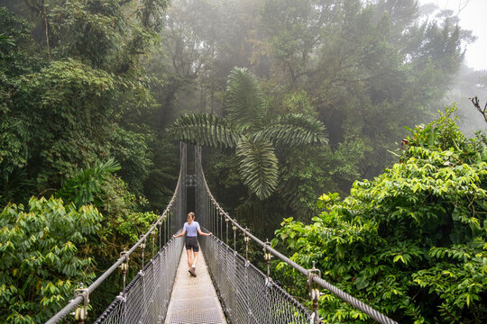 Walking on a suspension bridge in La Fortuna - Powered by Adobe