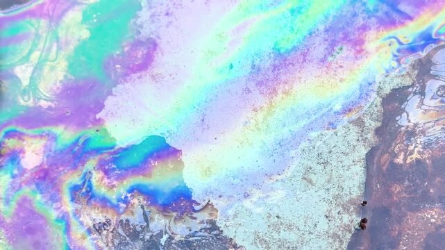 Oil petrol water pollution. Ecological disaster. Slick industry oil fuel spilling water pollution. Water with patches of gasoline and oil. Ecological catastrophe.  Concept of environmental problems