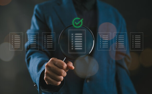 Women holding a magnifying glass, showing Audit Document concept, quality assessment management With a checklist, business document evaluation process, market data report analysis and consulting. - Powered by Adobe