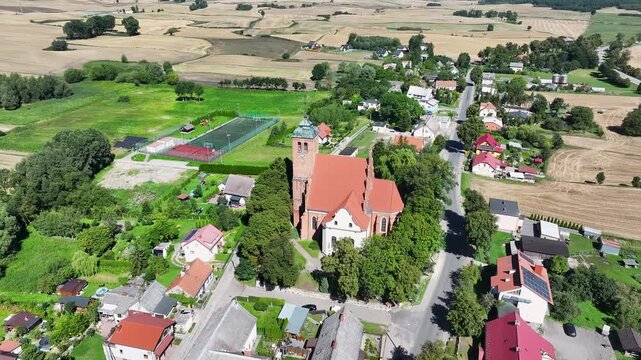 Aerial Piaseczno Poland Church Nativity Bless. Northern Poland. Crops, wheat, barley, grain, potatoes and corn. Agricultural equipment. Vistula River, Lake, forest and farm rural area and landscape. 