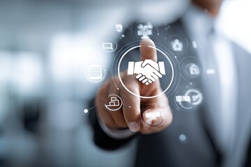 Businessman's finger touches a digital handshake icon surrounded by other business icons