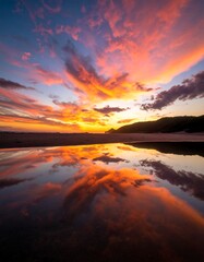 Vibrant Sunset Reflection on Beach