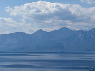 deep blue sea and beautiful distant mountains