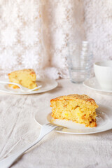 homemade apple streusel cake on white ceramic plate.