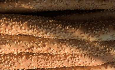 Homemade breadsticks with sesame seeds in the warm light of sunset