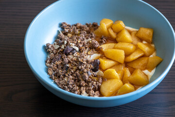 cozy autumn breakfast bowl greek yogurt granola caramelized apples close up