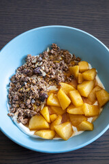 cozy autumn breakfast bowl greek yogurt granola caramelized apples close up