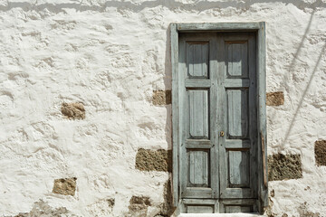 Serene Wooden Door Set Against a Crisp White Wall. Perfect for Modern and Minimalist Home Decor Themes