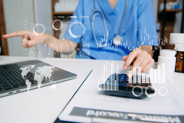 Nurse using laptop and calculator for healthcare planning and data analysis, highlighting modern...