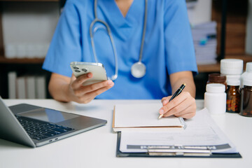 Medical technology concept. Doctor working with mobile phone and stethoscope and digital tablet...