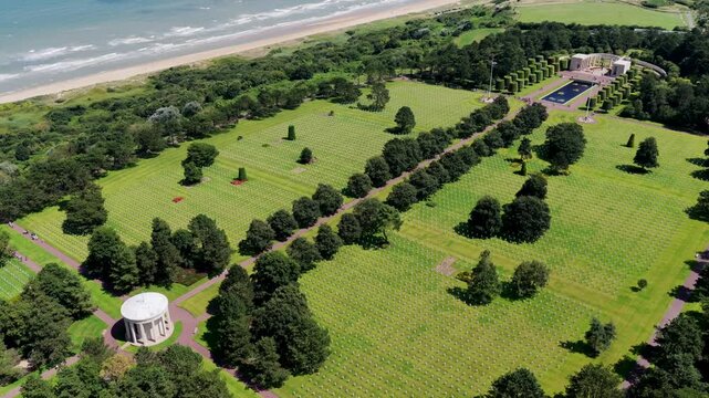 Aerial view of D-Day Cemetery - Cross shaped tombstones at the WW2 Graves of D-Day in Normandy, France - Americain World War 2 Cemetery and Memorial	