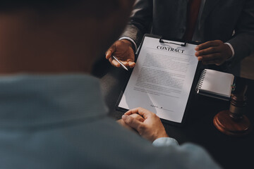 Lawyer explained to the client about the law that must be brought against the court case.