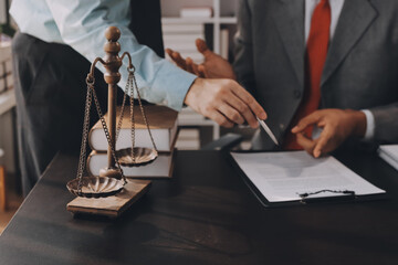 Lawyer explained to the client about the law that must be brought against the court case.